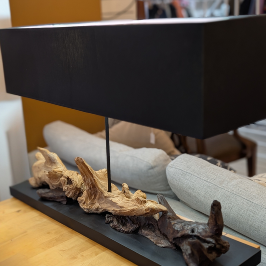 Sculptural driftwood table lamp with a sleek black rectangular shade