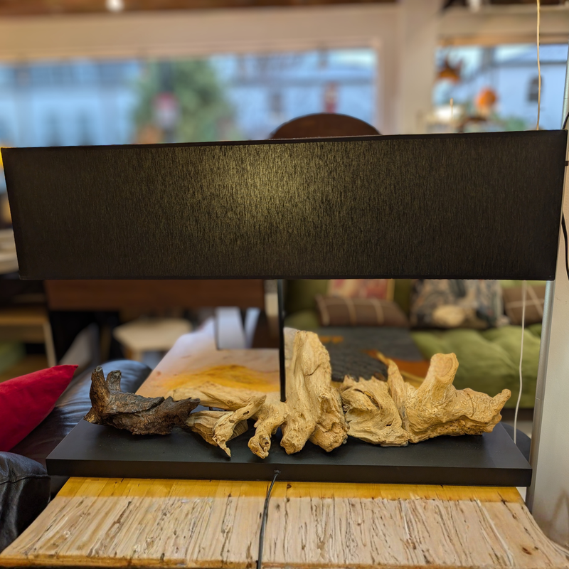 Sculptural driftwood table lamp with a sleek black rectangular shade