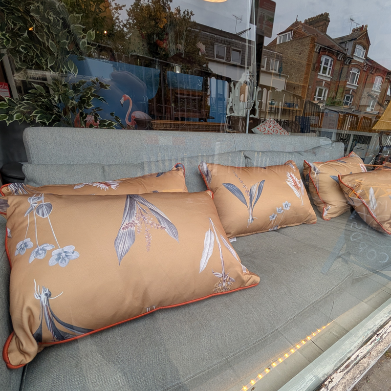 Ochre Botanical Print Cushions with Terracotta Piping.